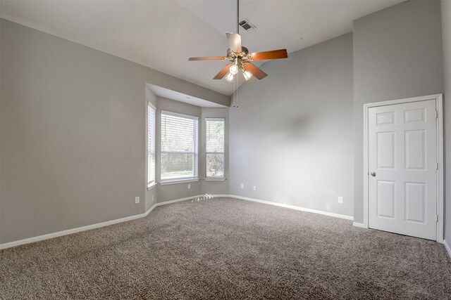 empty room with carpet, ceiling fan, and vaulted ceiling