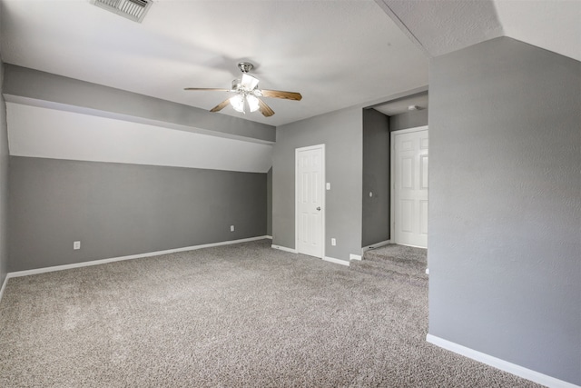 additional living space with carpet floors, ceiling fan, and lofted ceiling