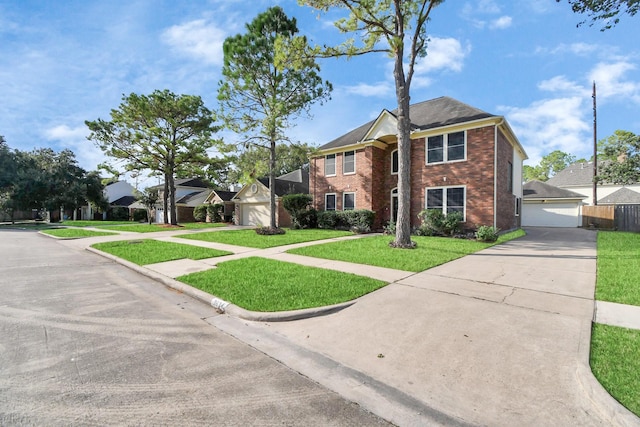 view of front of house featuring a garage and a front yard