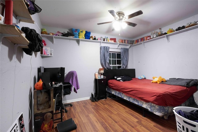 bedroom featuring ceiling fan and wood-type flooring