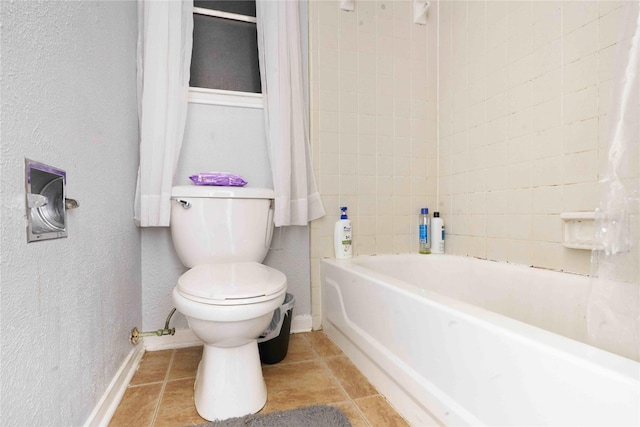 bathroom with tile patterned floors and toilet