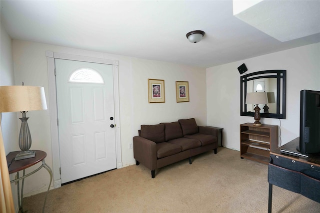 view of carpeted foyer entrance