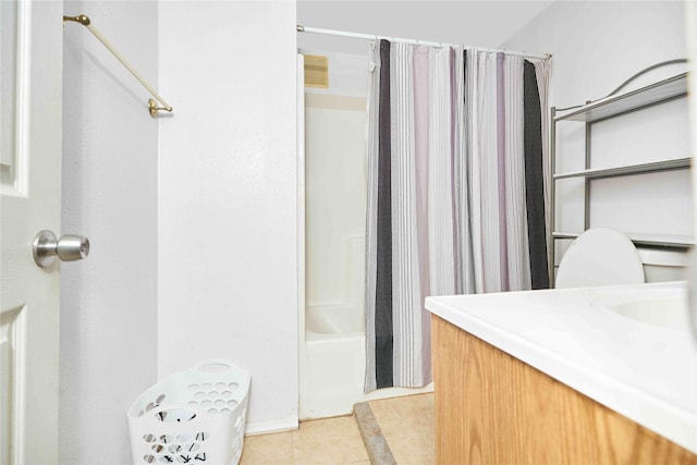 full bathroom with toilet, shower / bath combo, vanity, and tile patterned floors