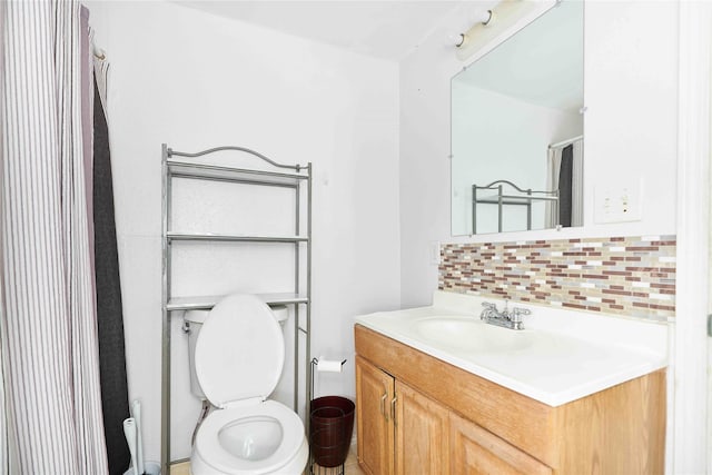 bathroom featuring backsplash, walk in shower, vanity, and toilet