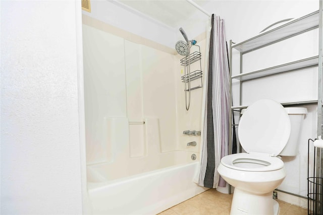 bathroom featuring tile patterned flooring, toilet, and shower / bathtub combination with curtain