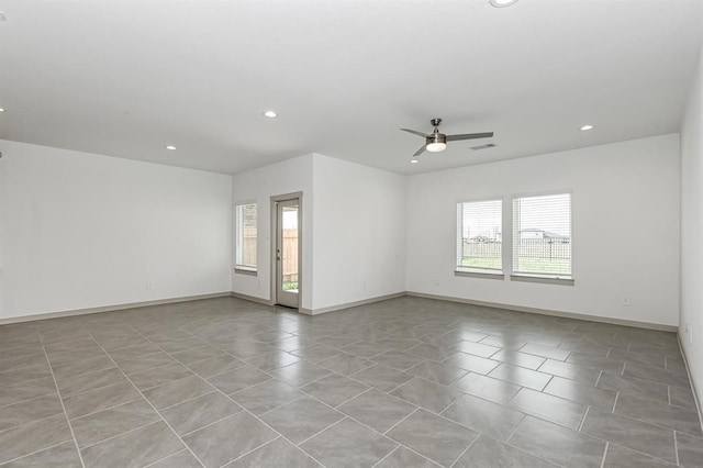 unfurnished room featuring ceiling fan, baseboards, and recessed lighting