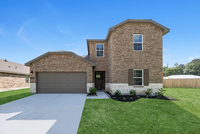 6605 Alexis St, Beaumont, TX 77708 - traditional-style house featuring concrete driveway, stone siding, brick siding, and a garage