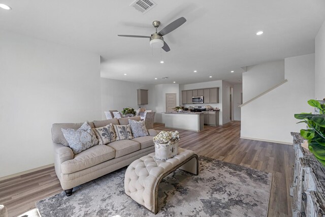 6605 Alexis St, Beaumont, TX 77708 - living room with wood finished floors, visible vents, recessed lighting, a ceiling fan, and baseboards