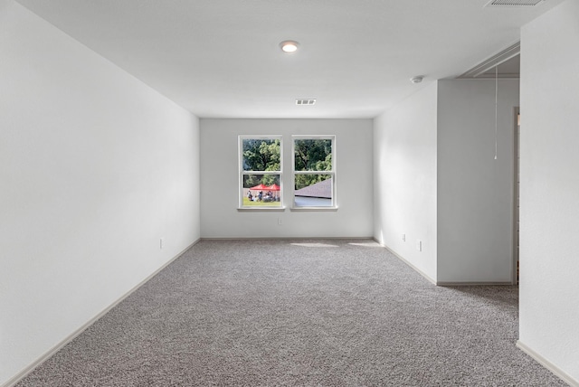 6605 Alexis St, Beaumont, TX 77708 - carpeted spare room featuring attic access, visible vents, and baseboards