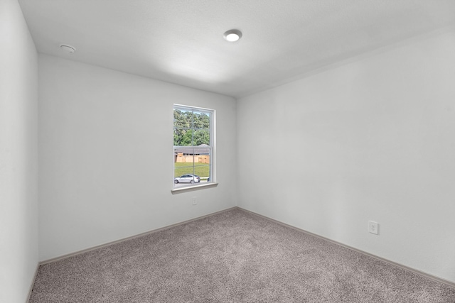 6605 Alexis St, Beaumont, TX 77708 - carpeted empty room featuring baseboards