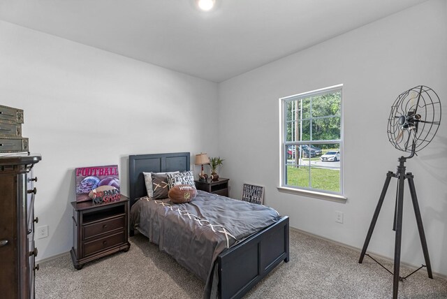 6605 Alexis St, Beaumont, TX 77708 - bedroom featuring light carpet and baseboards