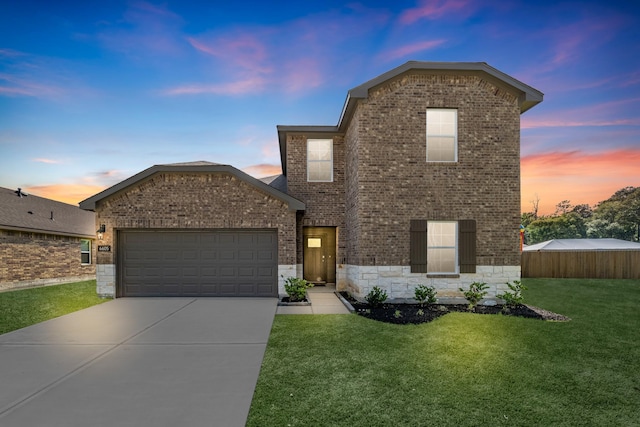 6605 Alexis St, Beaumont, TX 77708 - traditional-style home with a yard, driveway, brick siding, and an attached garage