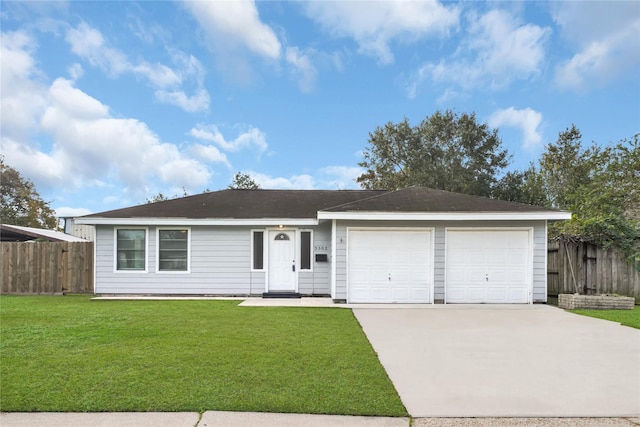 ranch-style home with a front yard and a garage