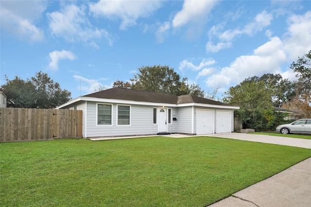 ranch-style home featuring a garage and a front lawn