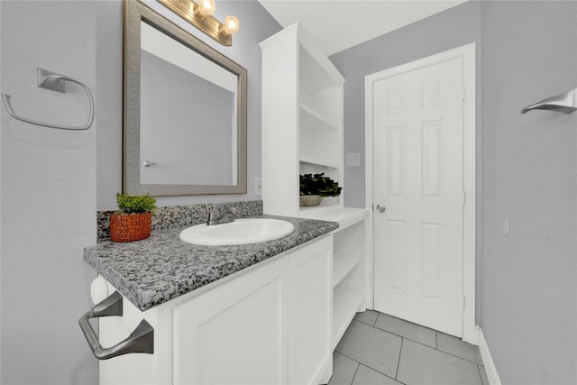 bathroom with tile patterned floors and vanity