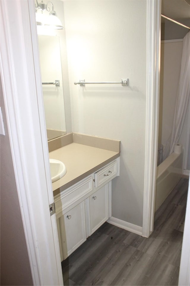 bathroom featuring hardwood / wood-style floors and vanity