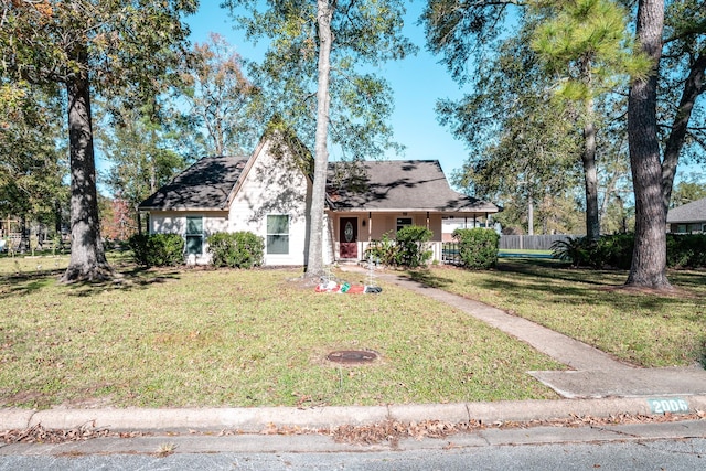 view of front of home featuring a front lawn and a porch