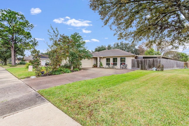 ranch-style house with a garage and a front lawn