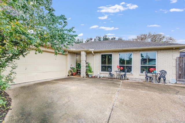 ranch-style home featuring a garage