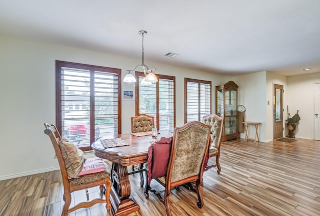 dining area with light hardwood / wood-style floors