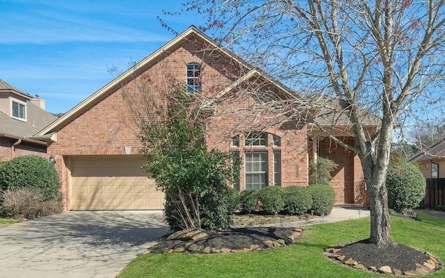 front of property featuring a garage and a front lawn