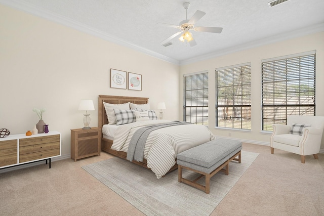 carpeted bedroom featuring a textured ceiling, ceiling fan, and crown molding