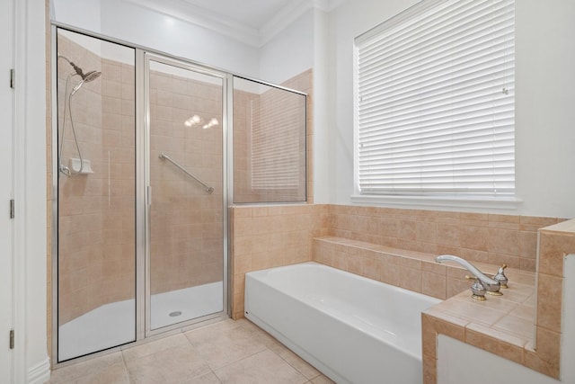 bathroom featuring shower with separate bathtub, tile patterned floors, and ornamental molding