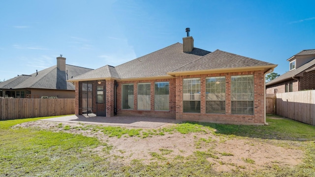 rear view of house with a patio