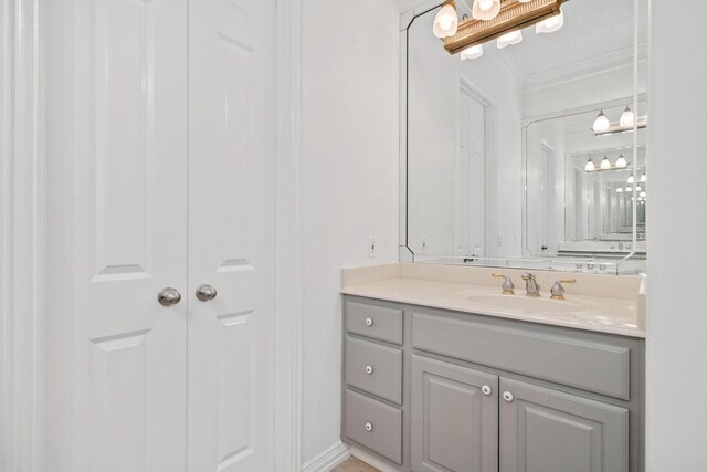 bathroom featuring vanity and ornamental molding