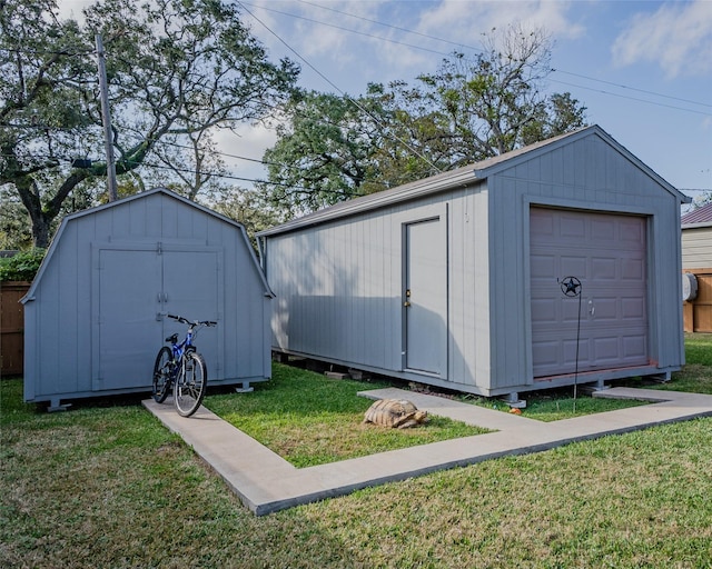 view of outbuilding featuring a lawn