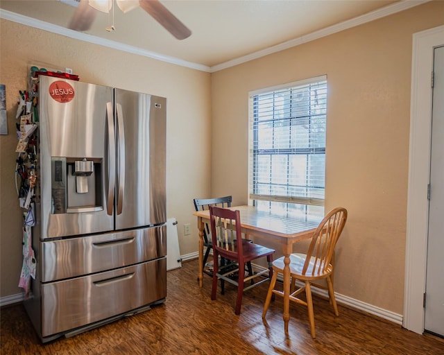 dining space with ceiling fan, crown molding, and dark hardwood / wood-style floors