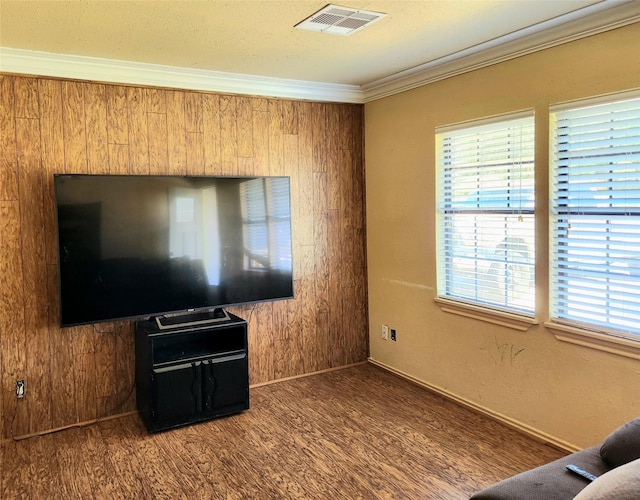 living room featuring hardwood / wood-style flooring and ornamental molding