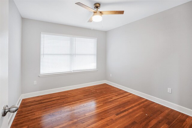 empty room with hardwood / wood-style flooring and ceiling fan