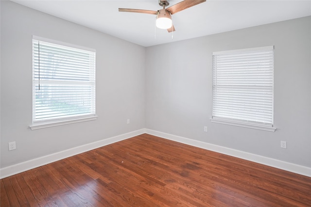 spare room featuring hardwood / wood-style flooring and ceiling fan