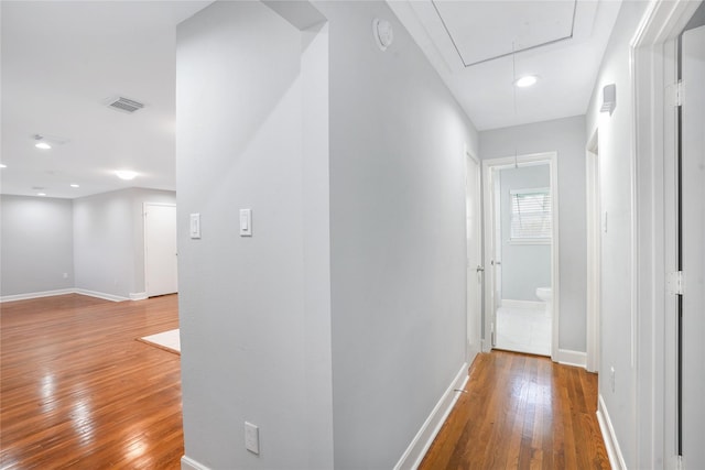 corridor featuring hardwood / wood-style floors