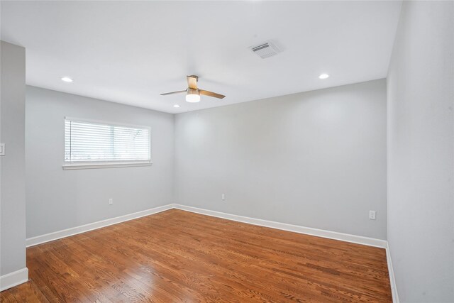 unfurnished room featuring hardwood / wood-style flooring and ceiling fan