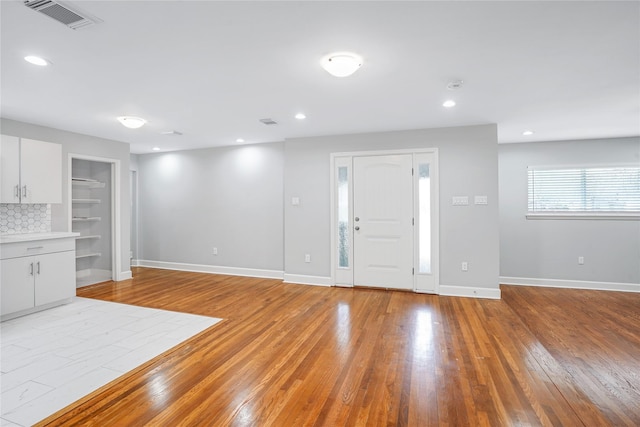 entryway with light hardwood / wood-style flooring