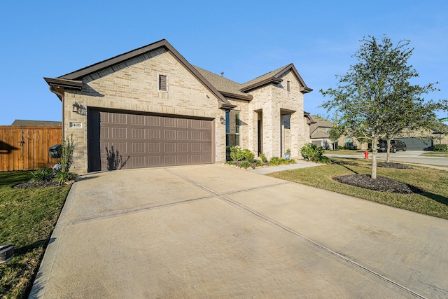 view of front of house featuring a front yard and a garage