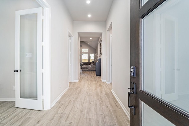 corridor with light wood-type flooring