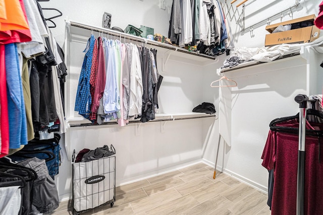 spacious closet with light wood-type flooring