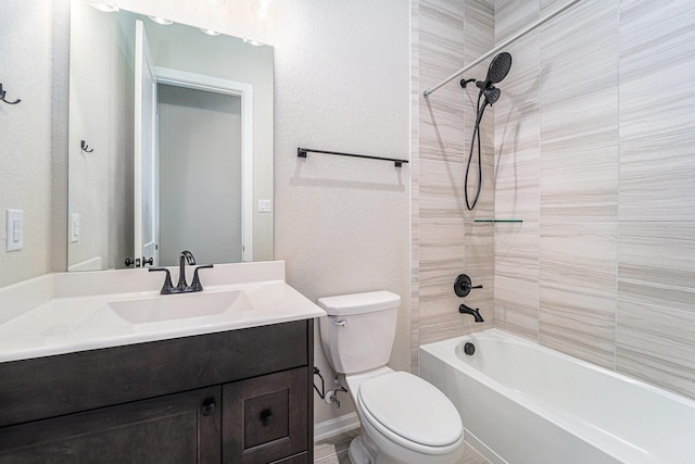 full bathroom with vanity, toilet, and tiled shower / bath combo