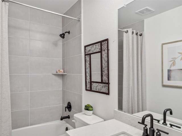 full bathroom with vanity, shower / bath combination with curtain, and toilet