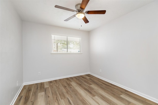 unfurnished room with ceiling fan and light hardwood / wood-style floors