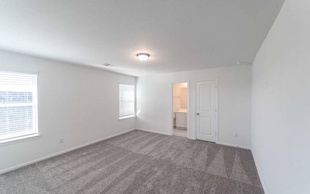 unfurnished room with carpet flooring