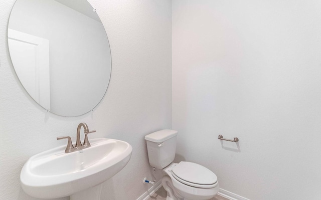 bathroom with sink and toilet