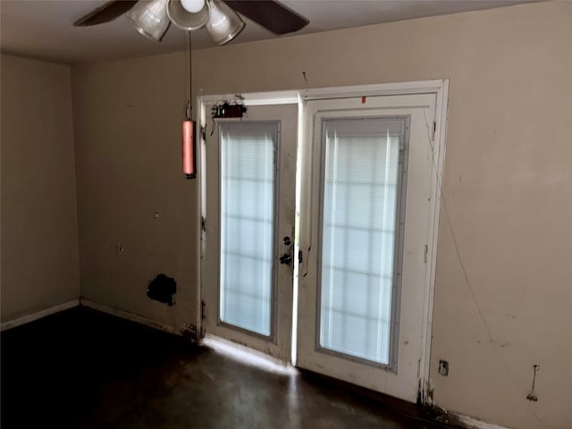 entryway featuring french doors, ceiling fan, and a healthy amount of sunlight