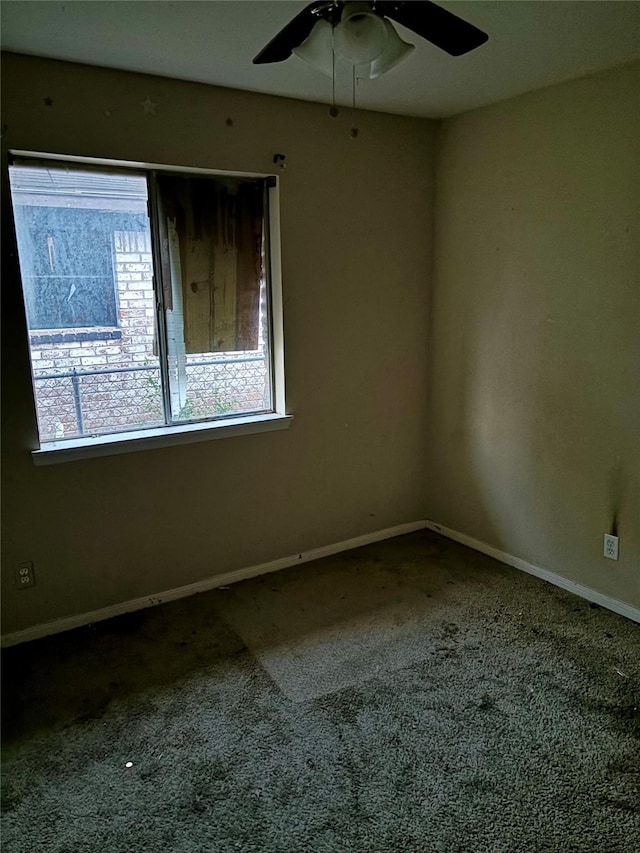 carpeted empty room with ceiling fan