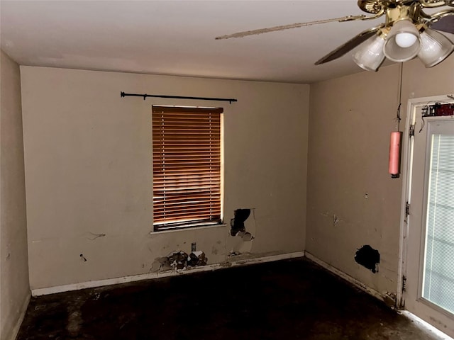 unfurnished room with ceiling fan