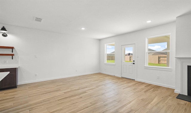 entryway with light hardwood / wood-style floors