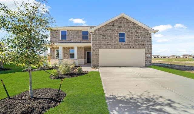 view of front of home with a front lawn and a garage